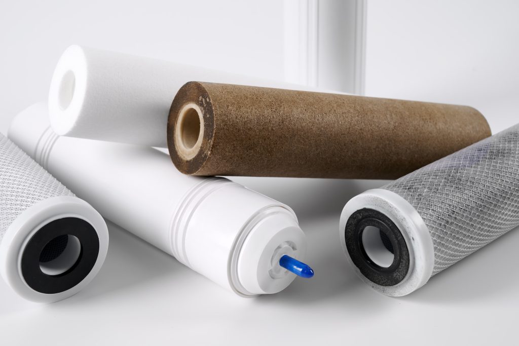 Several new and used dirty water filter cartridges. Water purification technology in areas with unfavorable ecology.